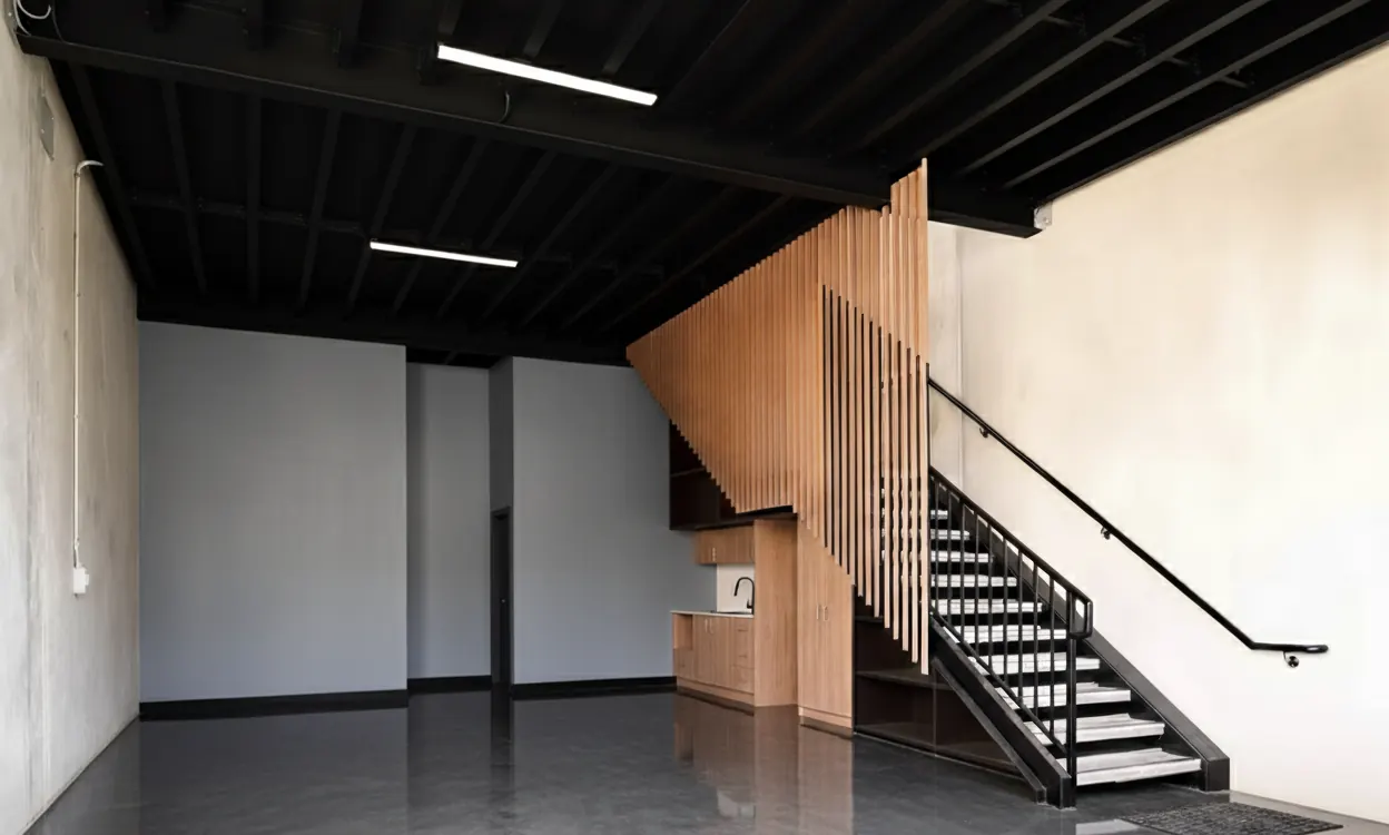 Warehouse interior with timber stair and mezzanine